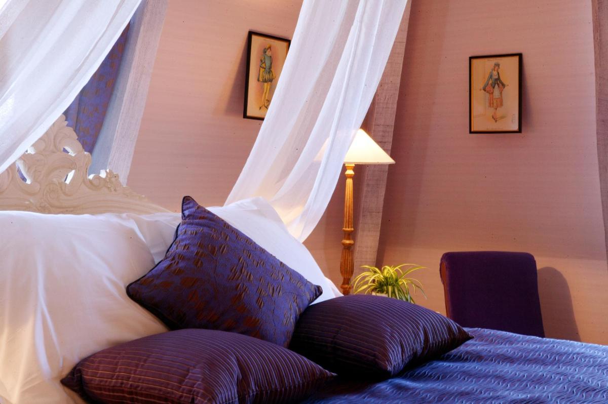 Un ou plusieurs lits dans un hébergement de l'établissement Clos La Boëtie & Spa