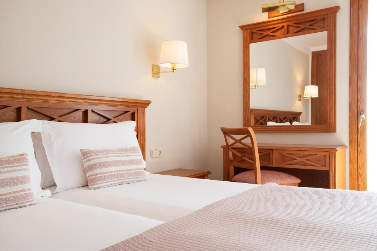 Cama o camas de una habitación en Inturotel Cala Azul
