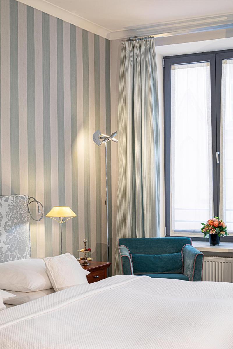 Ein Bett oder Betten in einem Zimmer der Unterkunft Hotel Goliath am Dom