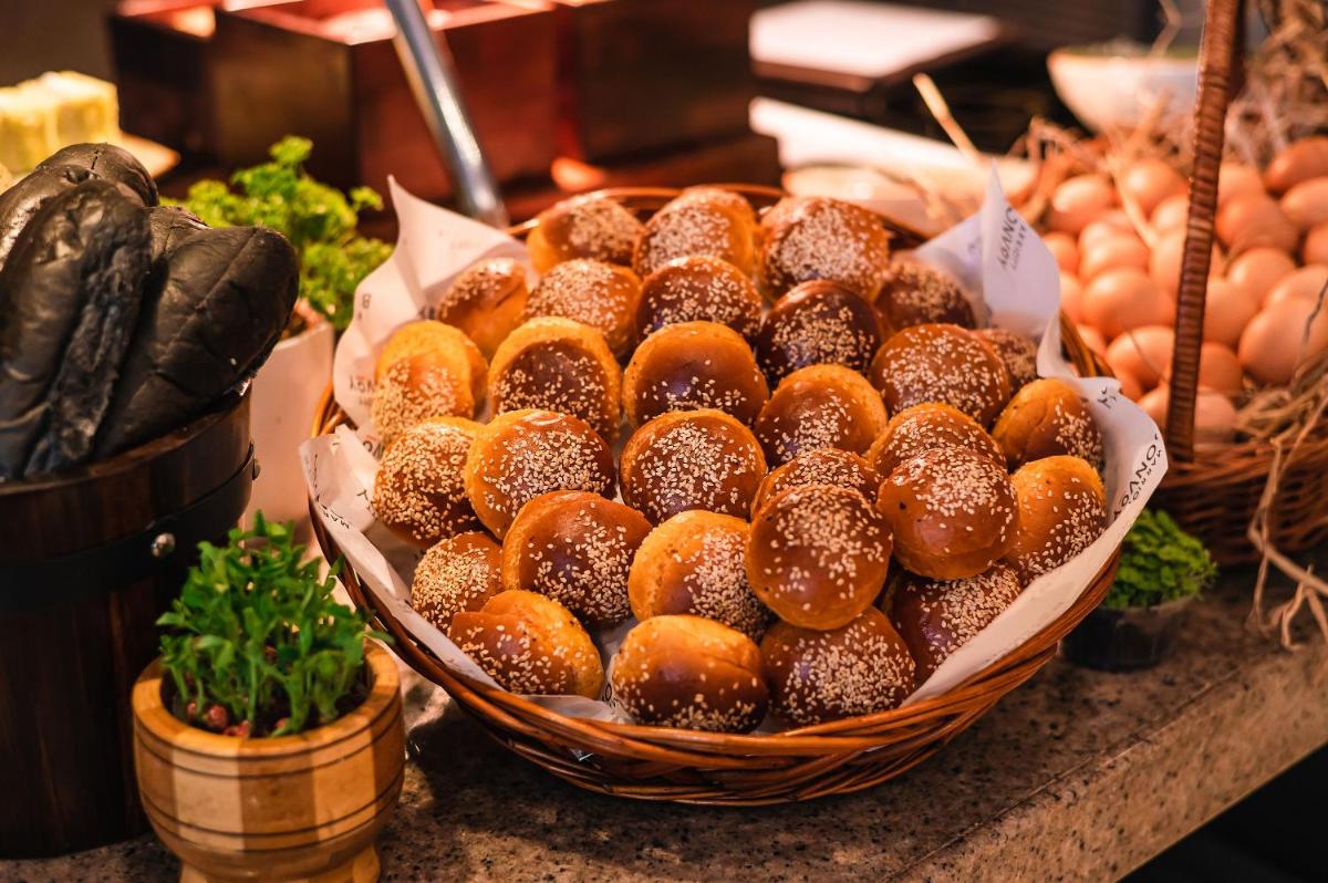a basket of donuts sitting on top of a counter at JW Marriott Hotel Bengaluru in Bengaluru