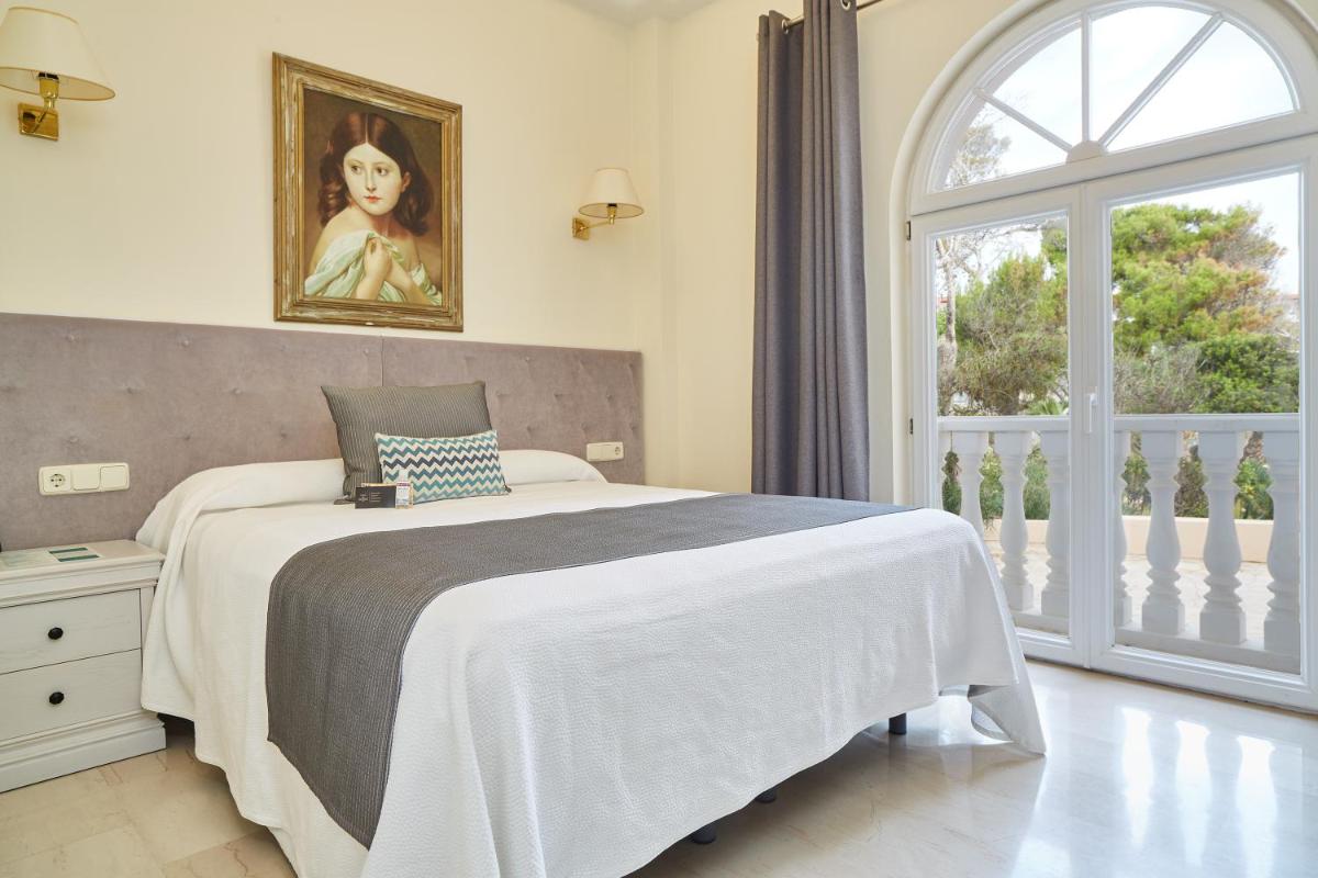 Cama o camas de una habitación en Grand Hotel Palladium Santa Eulalia del Río