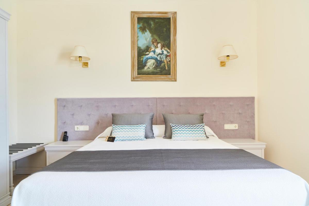 Cama o camas de una habitación en Grand Hotel Palladium Santa Eulalia del Río