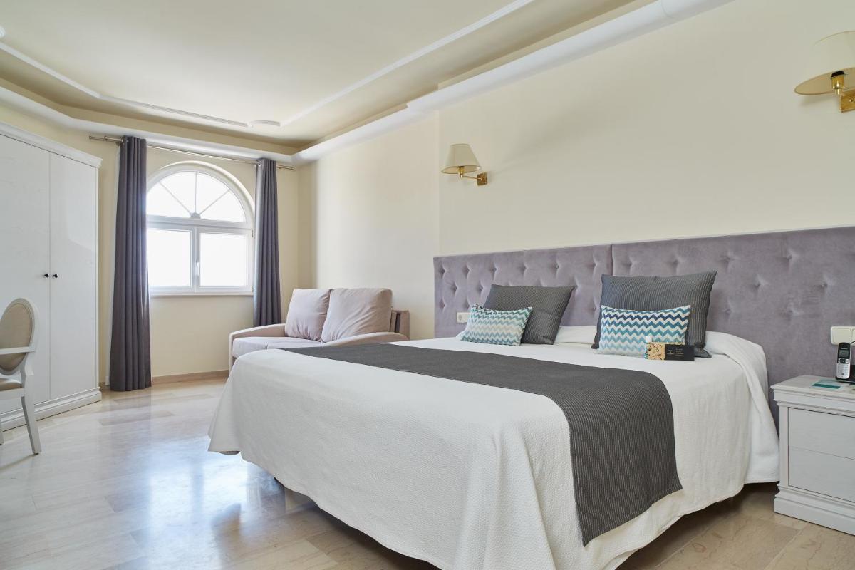 Cama o camas de una habitación en Grand Hotel Palladium Santa Eulalia del Río