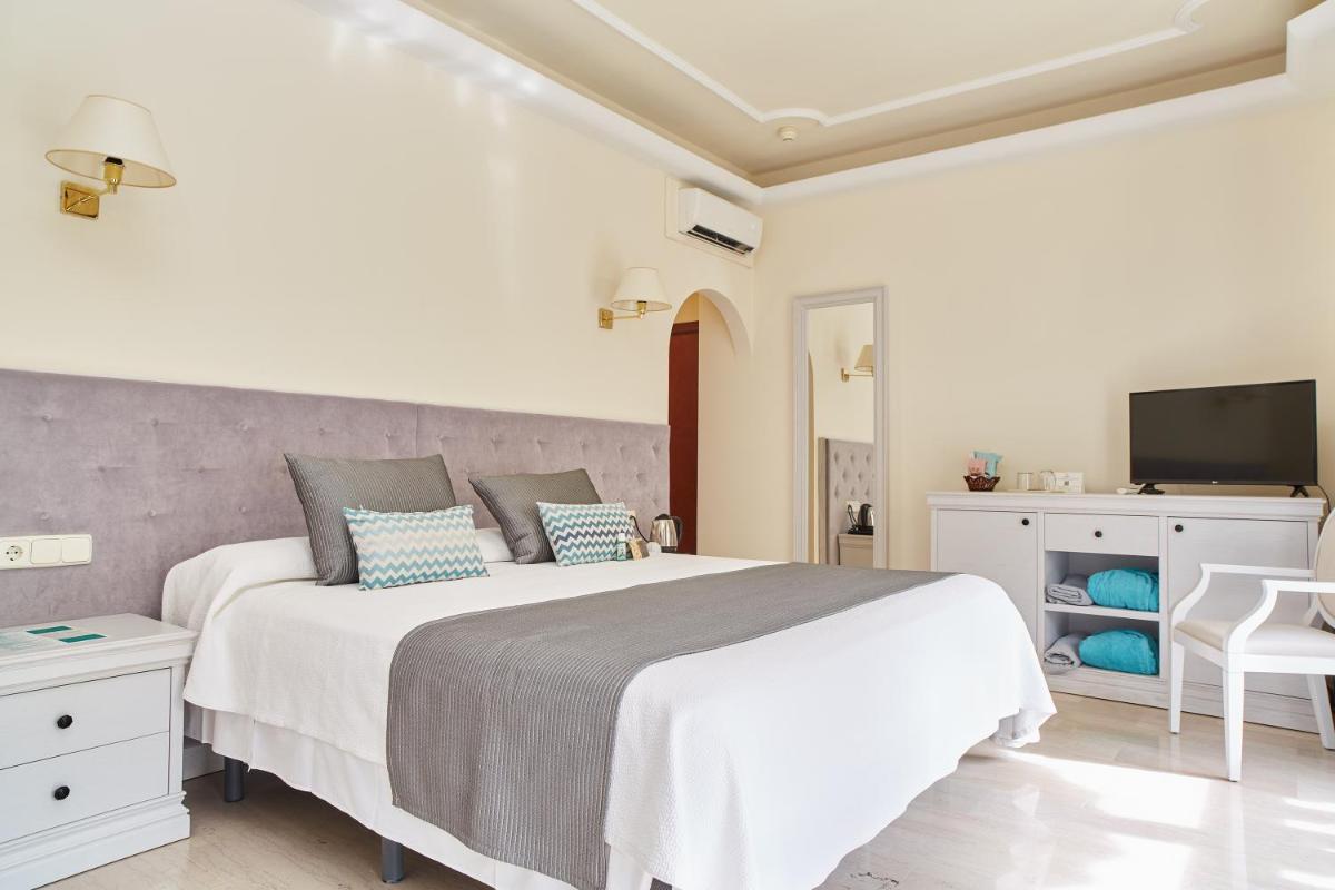 Cama o camas de una habitación en Grand Hotel Palladium Santa Eulalia del Río