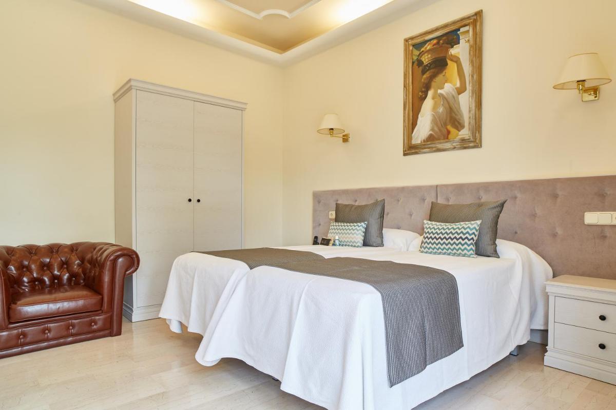 Cama o camas de una habitación en Grand Hotel Palladium Santa Eulalia del Río