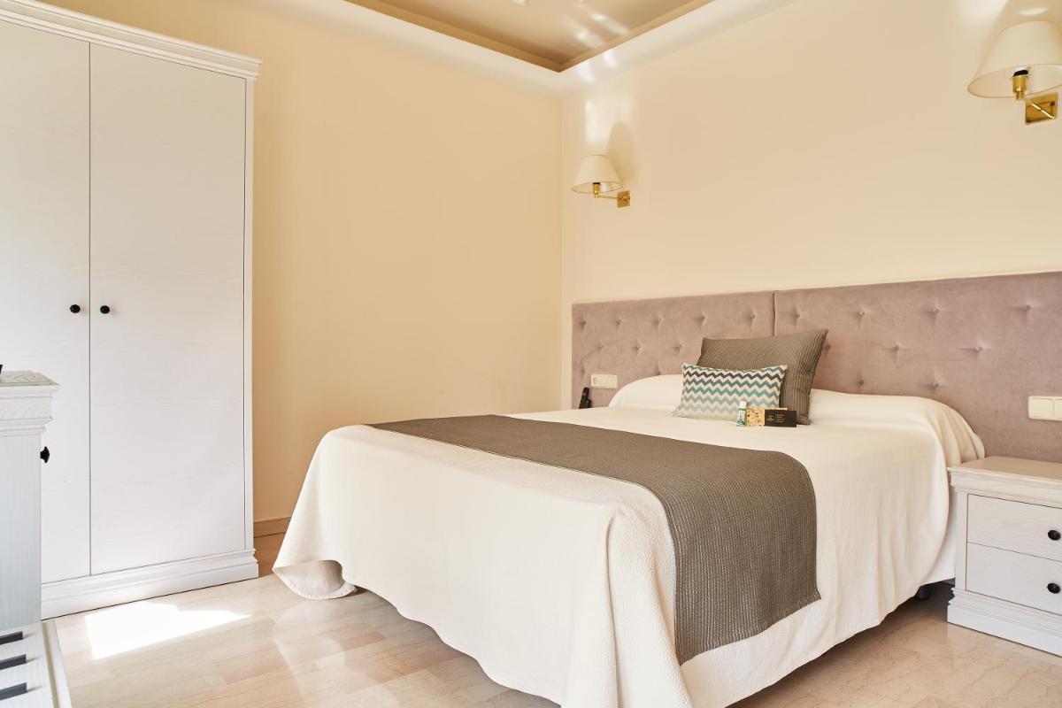 Cama o camas de una habitación en Grand Hotel Palladium Santa Eulalia del Río