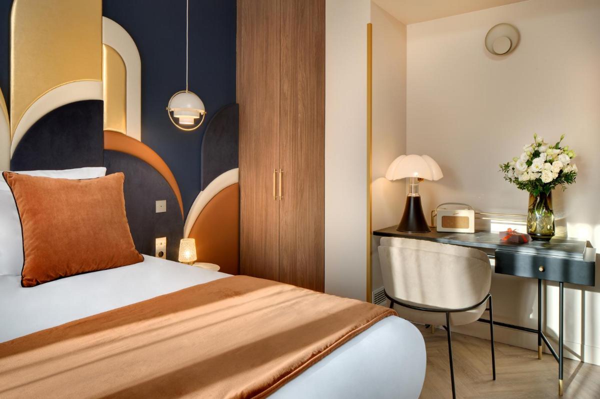 Un ou plusieurs lits dans un hébergement de l'établissement Hôtel Artemisia Montmartre