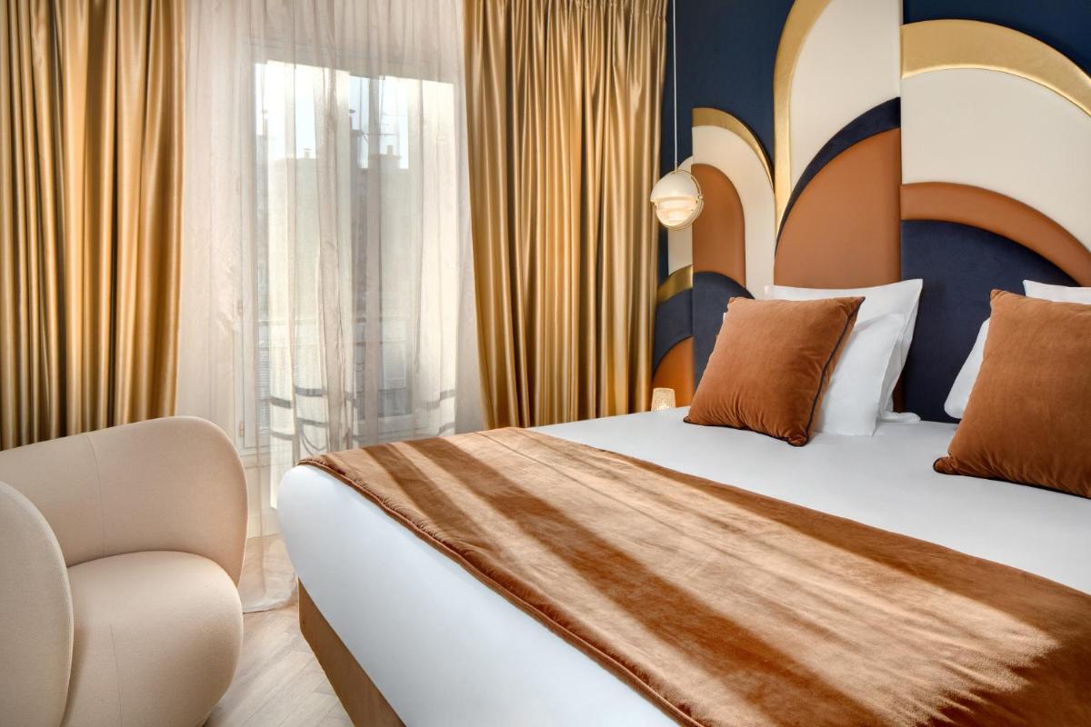 Un ou plusieurs lits dans un hébergement de l'établissement Hôtel Artemisia Montmartre