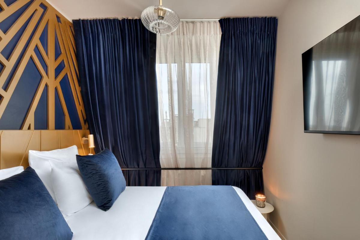 Un ou plusieurs lits dans un hébergement de l'établissement Hôtel Artemisia Montmartre