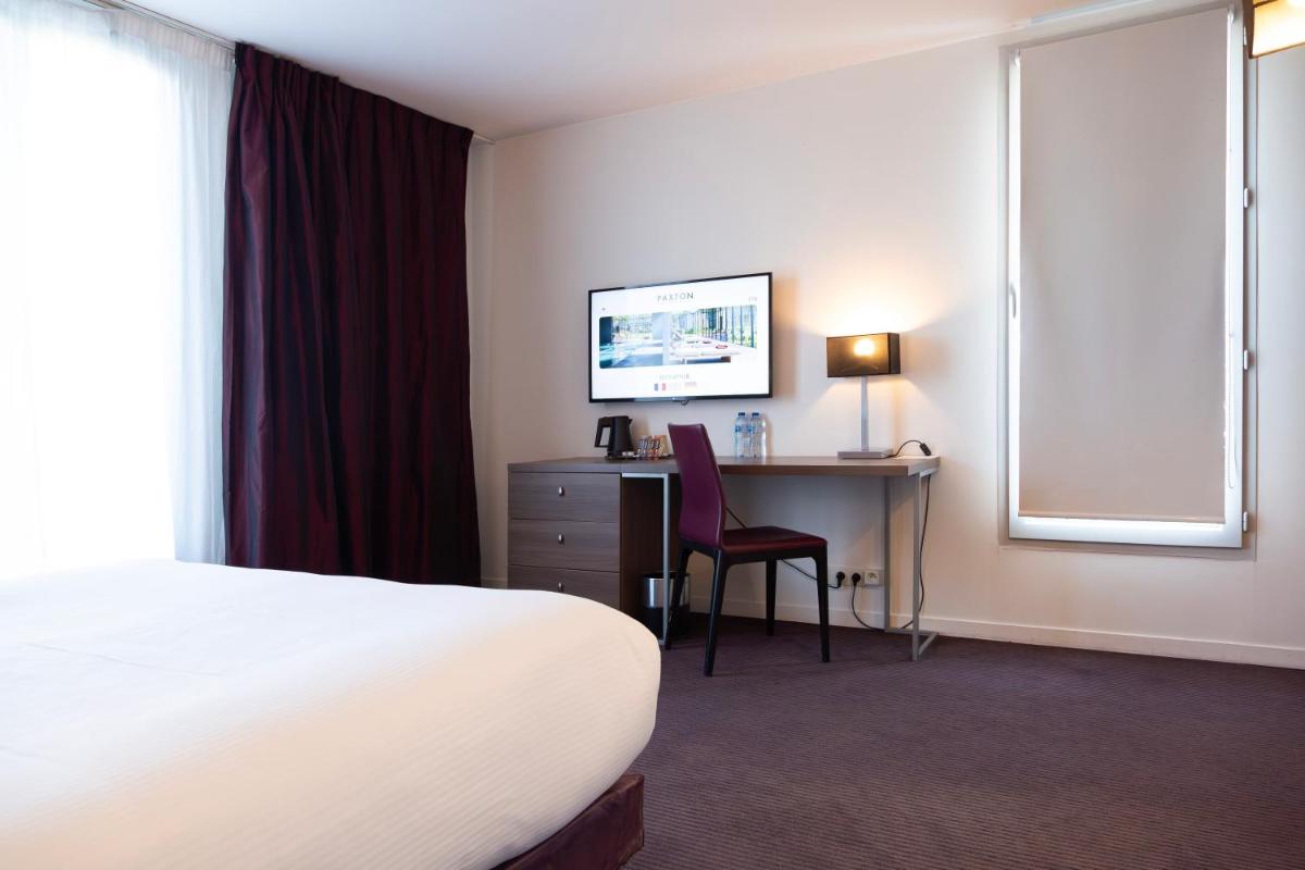 Un ou plusieurs lits dans un hébergement de l'établissement Paxton Paris MLV