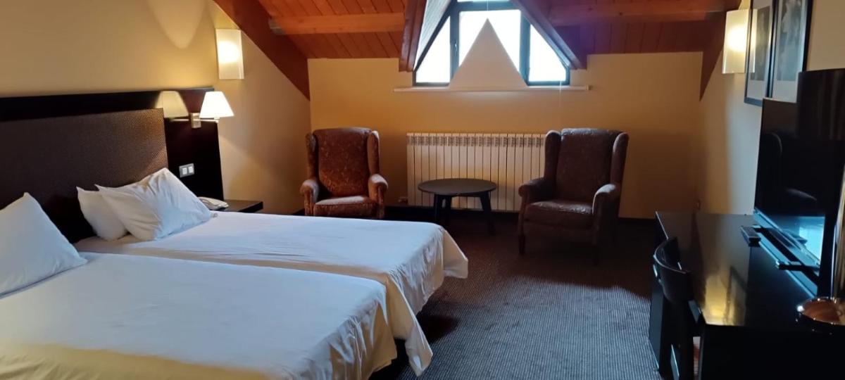 Cama o camas de una habitación en HG Alto Aragón