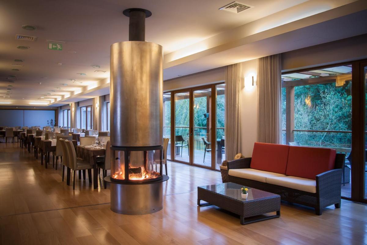 Uma área de estar em Hotel Rural Vale Do Rio
