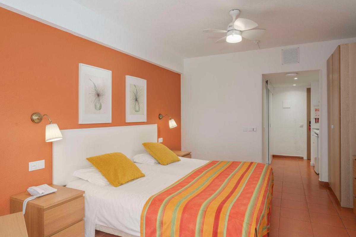 Uma cama ou camas num quarto em Florasol Residence Hotel - Dorisol hotels
