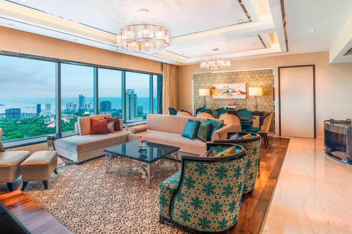 a living room with a couch and a table at The St. Regis Mumbai in Mumbai