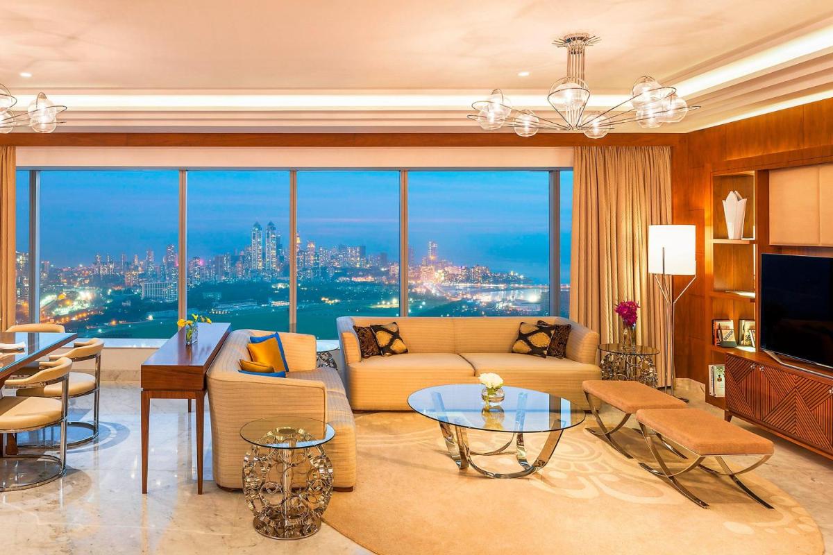 a living room with a couch and a table at The St. Regis Mumbai in Mumbai