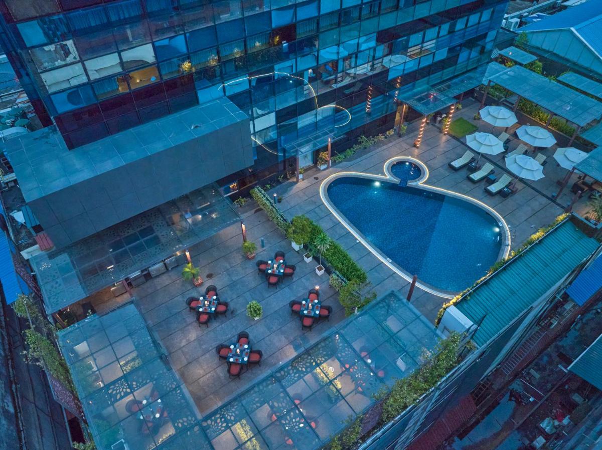 an overhead view of a pool in front of a building at The Raviz Calicut in Kozhikode