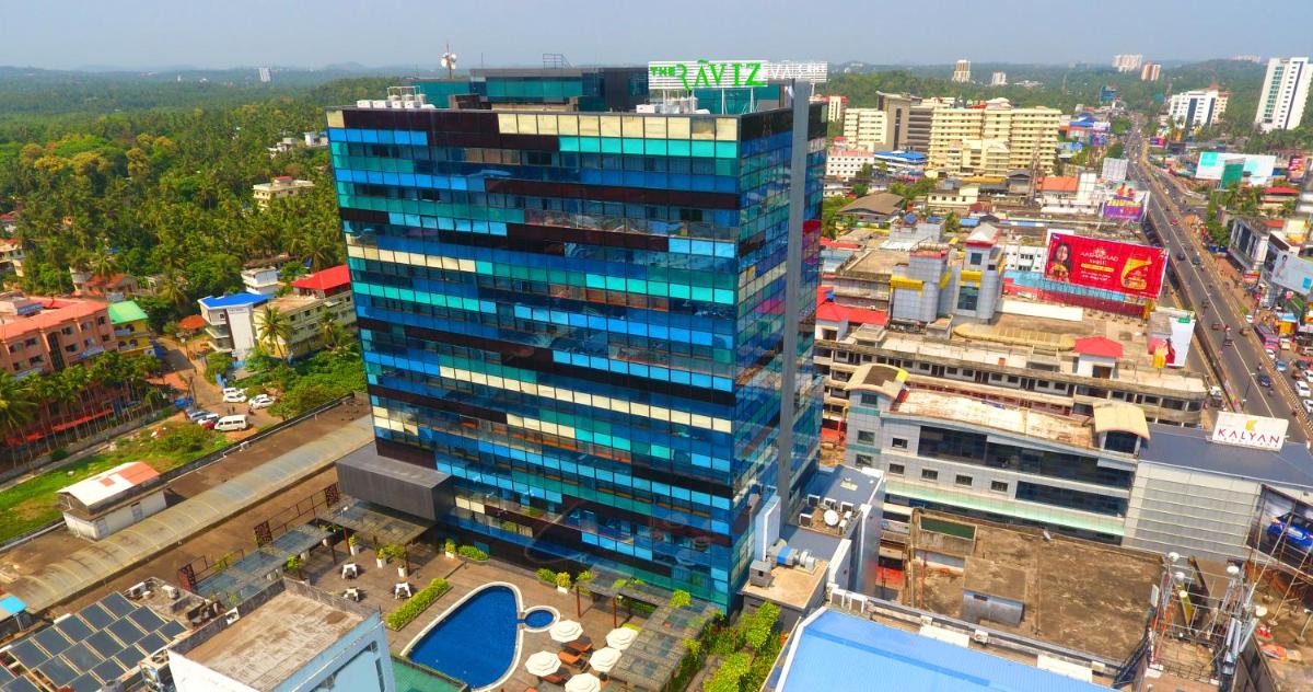 an overhead view of a city with a tall building at The Raviz Calicut in Kozhikode