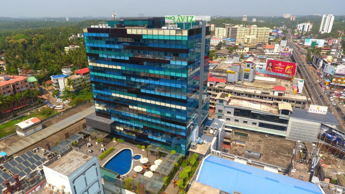 an overhead view of a city with a tall building at The Raviz Calicut in Kozhikode