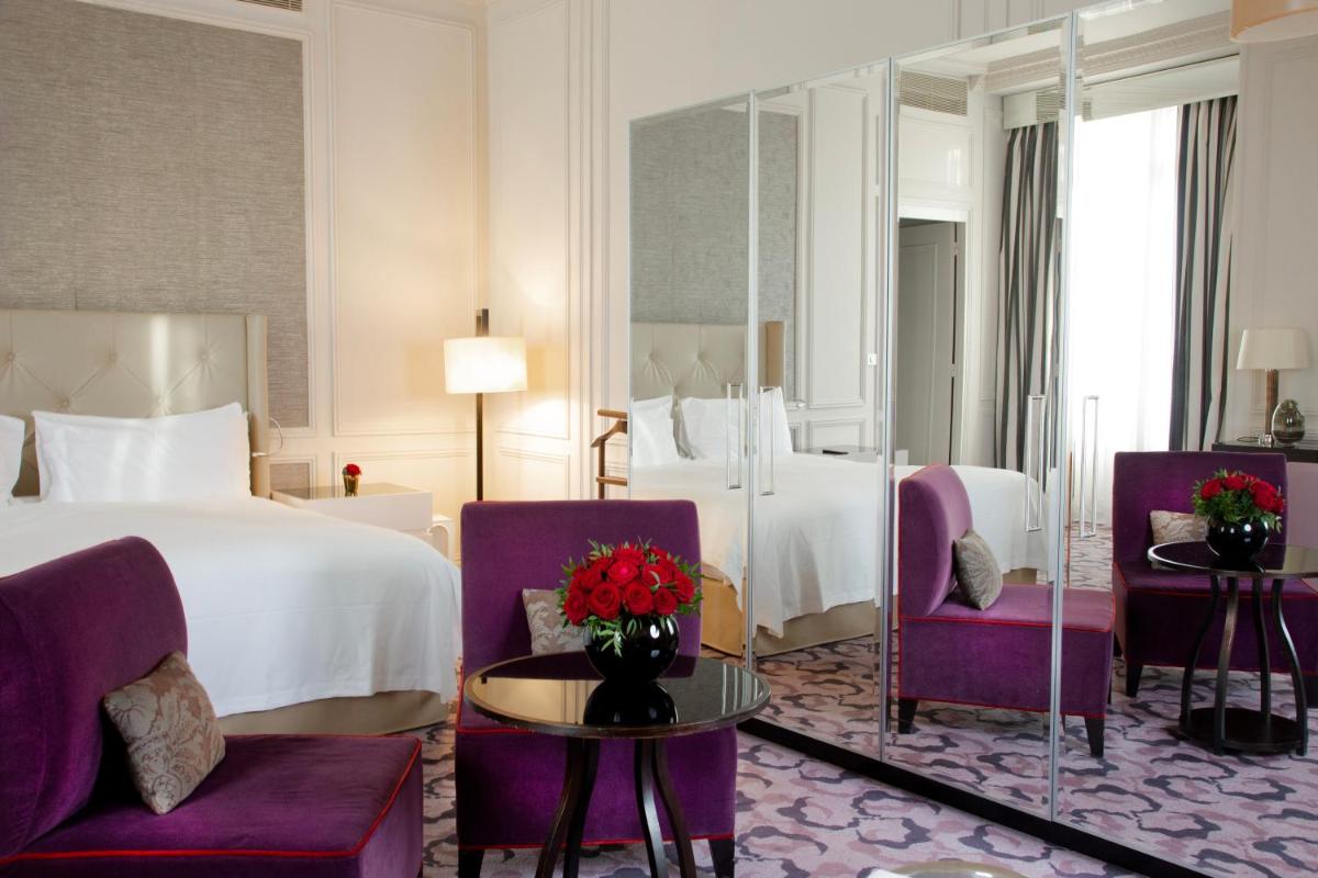 Un ou plusieurs lits dans un hébergement de l'établissement Waldorf Astoria Versailles - Trianon Palace