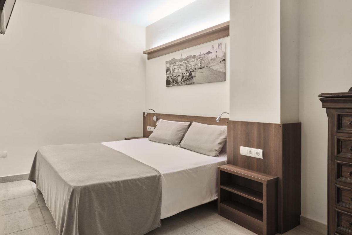 Cama o camas de una habitación en Sunway Playa Golf & Spa Sitges