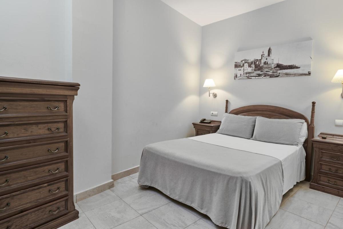Cama o camas de una habitación en Sunway Playa Golf & Spa Sitges