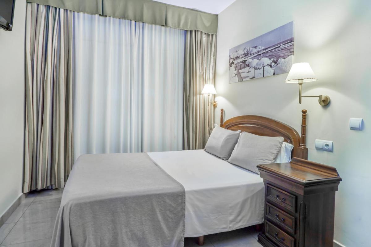 Cama o camas de una habitación en Sunway Playa Golf & Spa Sitges