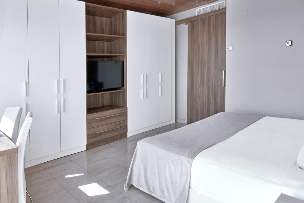 Cama o camas de una habitación en Sunway Playa Golf & Spa Sitges