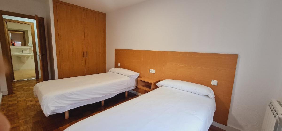 Cama o camas de una habitación en Estación de Montaña Manzaneda