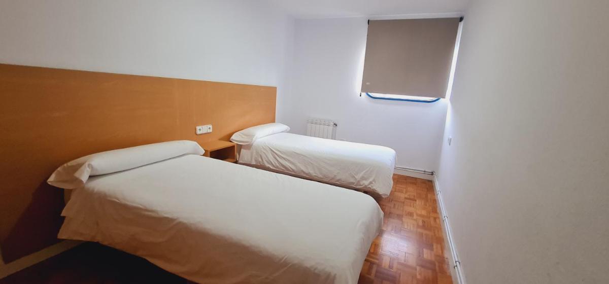 Cama o camas de una habitación en Estación de Montaña Manzaneda