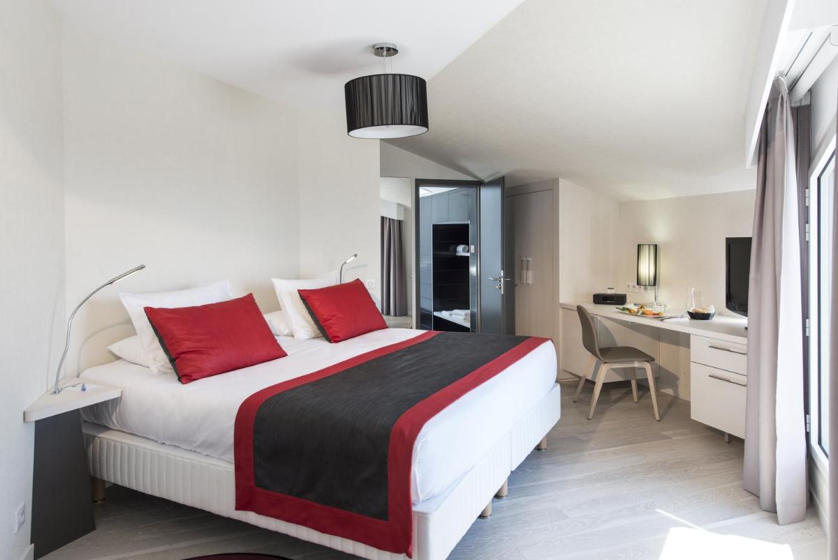 Un ou plusieurs lits dans un hébergement de l'établissement Hôtel Valdys Thalasso & Spa - les Pins