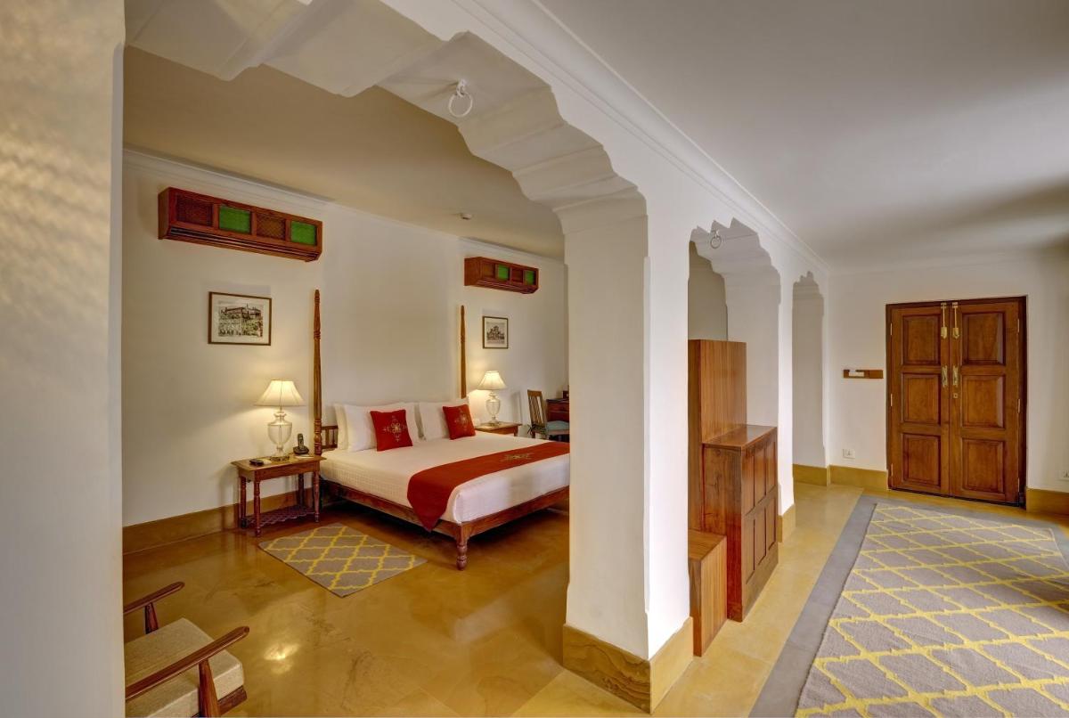 a bedroom with a bed in a room at Saraca Hotel Lucknow in Lucknow