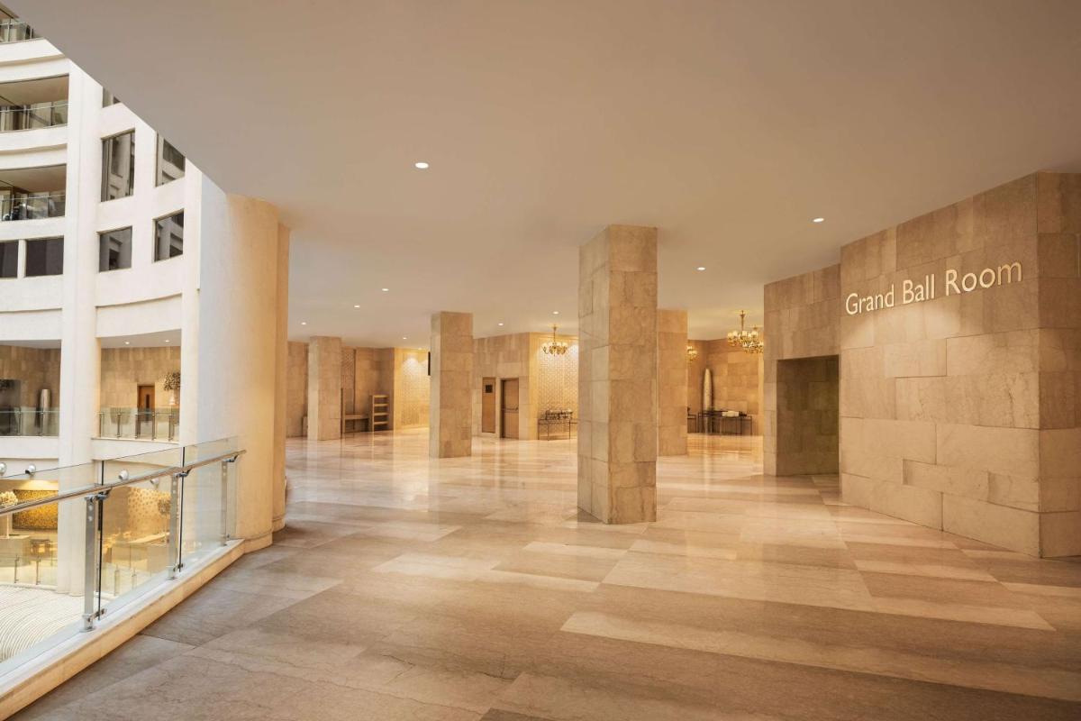 a lobby of a shopping mall with a sign that reads central room at Radisson Blu Hotel New Delhi Dwarka in New Delhi a lobby of a shopping mall with a sign that reads central room at Radisson Blu Hotel New Delhi Dwarka in New Delhi