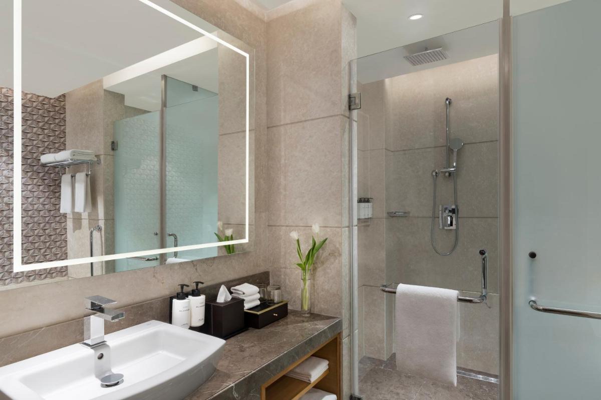a bathroom with a sink and a shower at InterContinental Jaipur Tonk Road by IHG in Jaipur