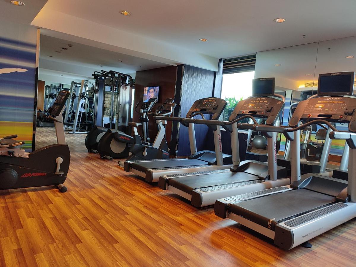 a gym with a bunch of tread machines in it at Aloft Bengaluru Outer Ring Road in Bengaluru