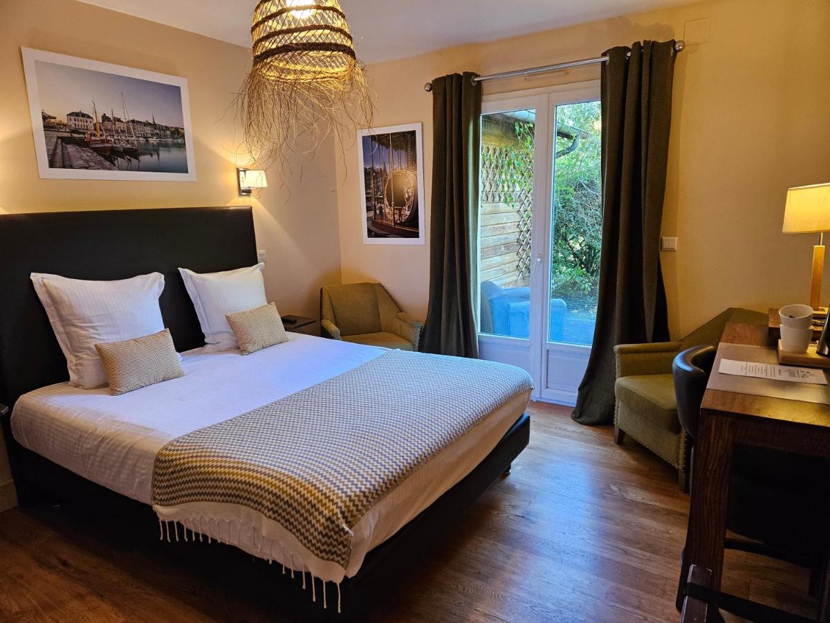 Un ou plusieurs lits dans un hébergement de l'établissement La Fraîchette-Hôtel & Spa