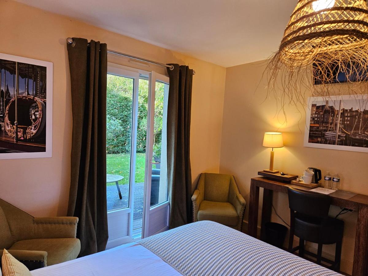 Un ou plusieurs lits dans un hébergement de l'établissement La Fraîchette-Hôtel & Spa