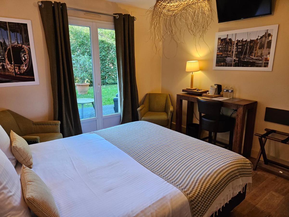 Un ou plusieurs lits dans un hébergement de l'établissement La Fraîchette-Hôtel & Spa