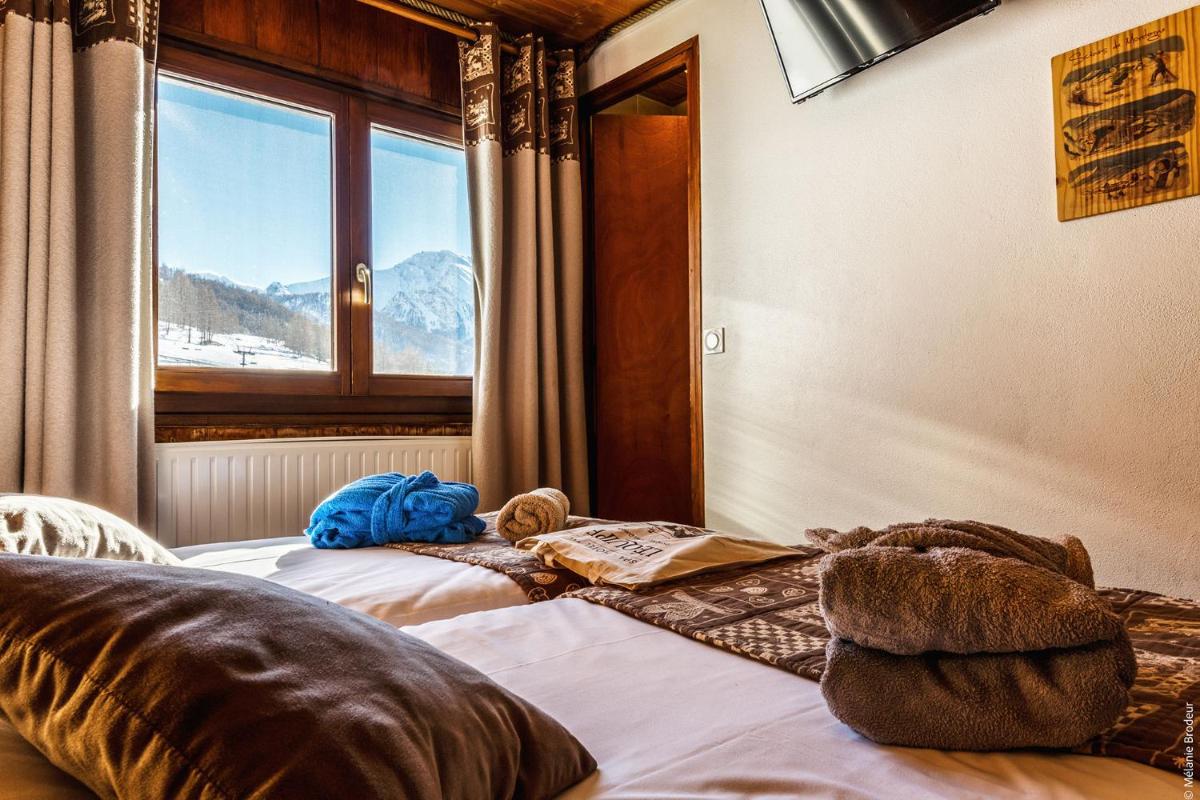 Un ou plusieurs lits dans un hébergement de l'établissement Hotel Spa L'Equipe