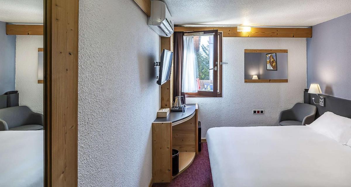 Un ou plusieurs lits dans un hébergement de l'établissement Sure Hotel by Best Western Annecy