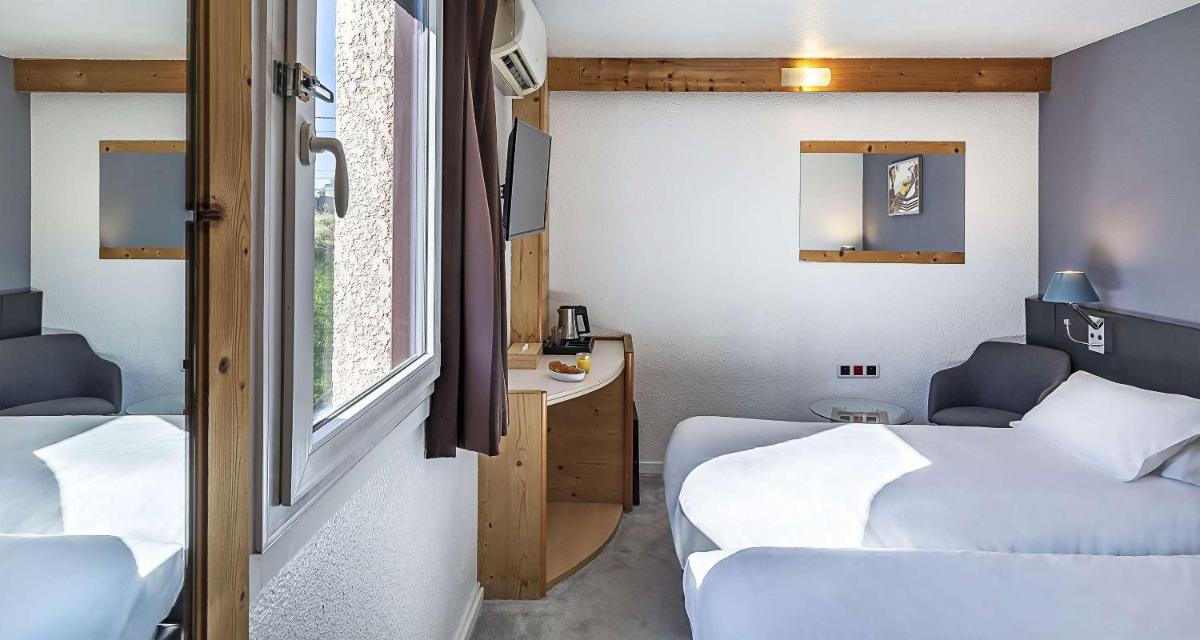 Un ou plusieurs lits dans un hébergement de l'établissement Sure Hotel by Best Western Annecy