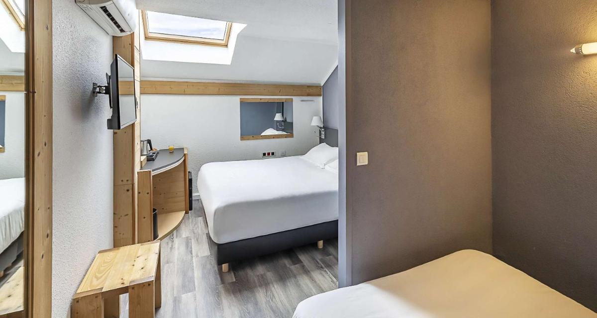 Un ou plusieurs lits dans un hébergement de l'établissement Sure Hotel by Best Western Annecy