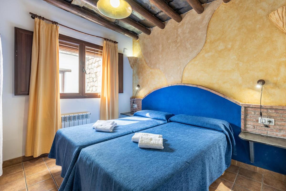 Cama o camas de una habitación en Turismo Rural & SPA El Cercado