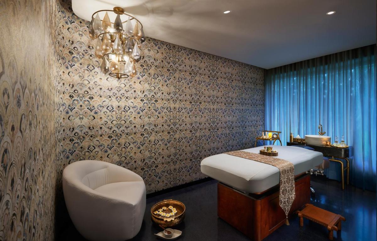 a bathroom with a bed and a tub and a sink at Hyatt Centric Sector17 Chandigarh in Chandīgarh