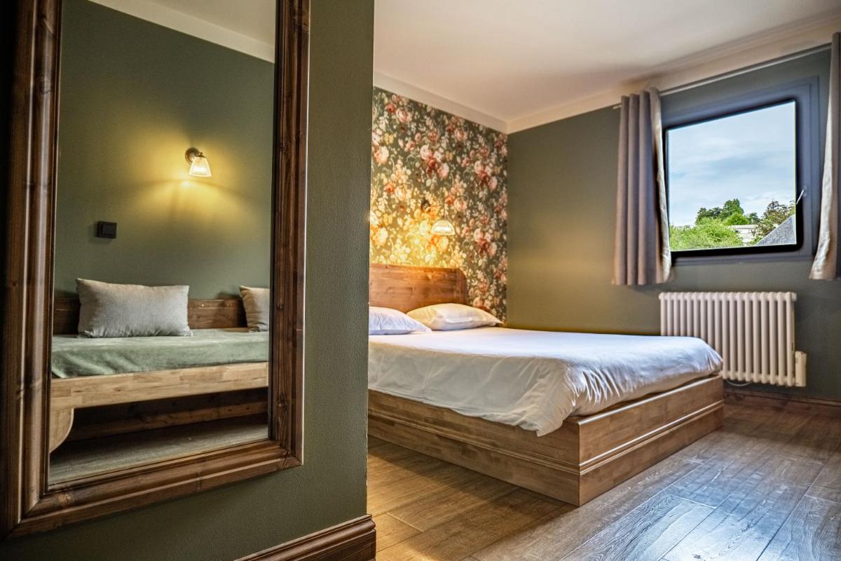 Un ou plusieurs lits dans un hébergement de l'établissement La Maison Rouge