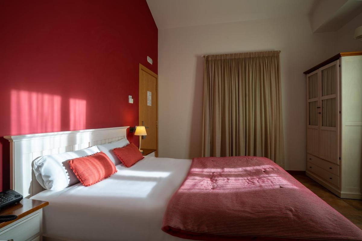 Cama o camas de una habitación en Hotel & Spa Golden Barcelona