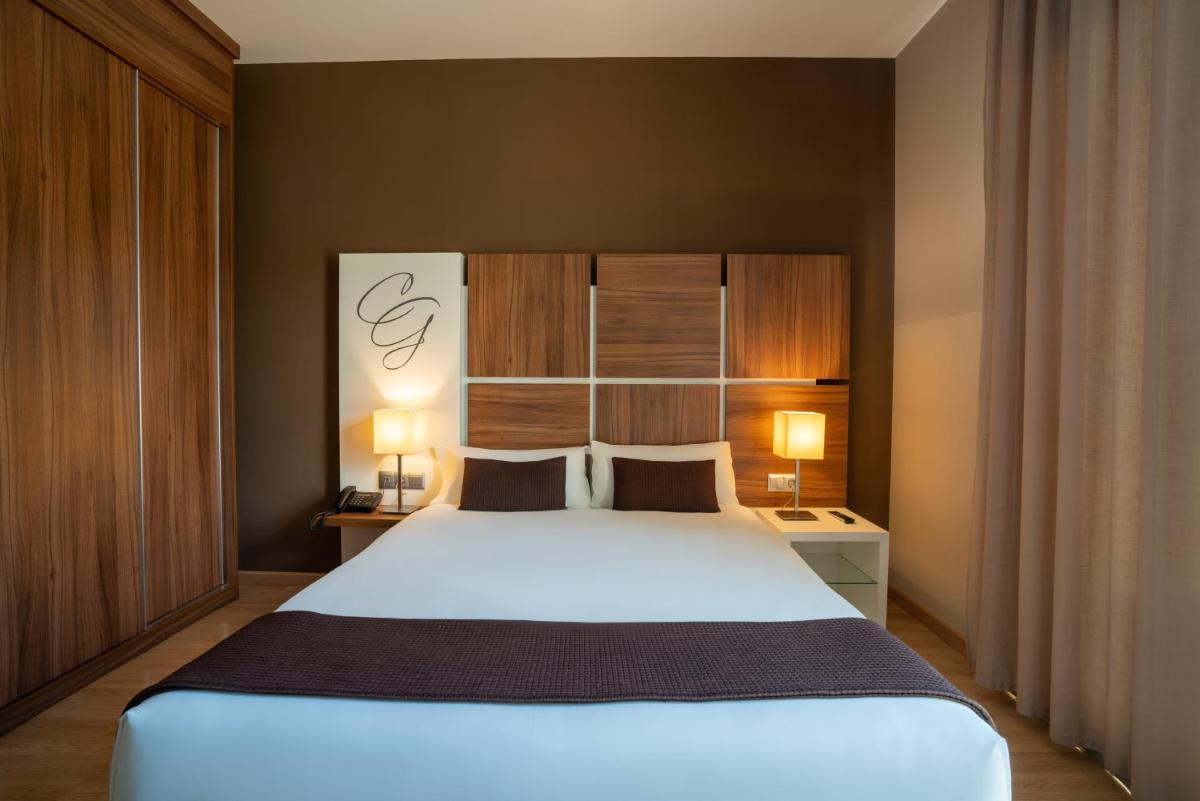 Cama o camas de una habitación en Hotel & Spa Golden Barcelona
