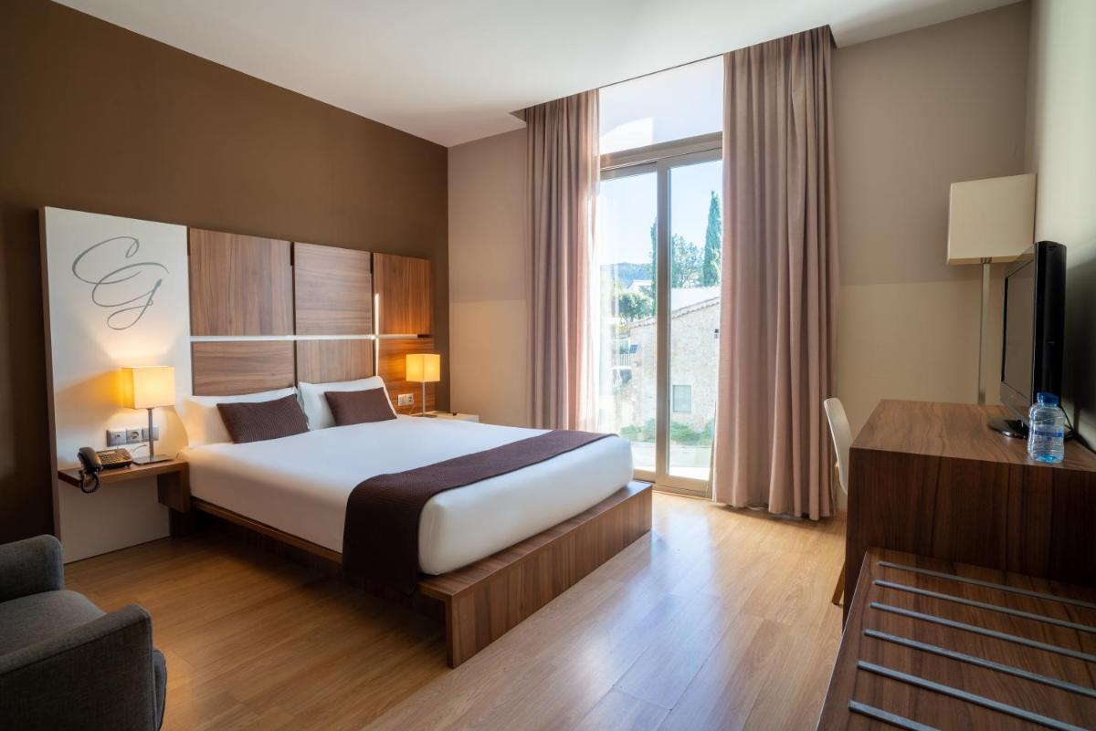 Cama o camas de una habitación en Hotel & Spa Golden Barcelona