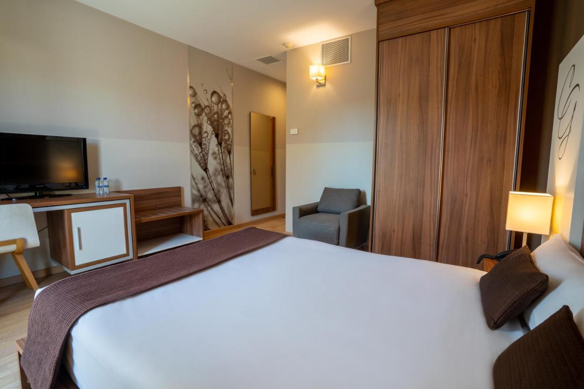 Cama o camas de una habitación en Hotel & Spa Golden Barcelona
