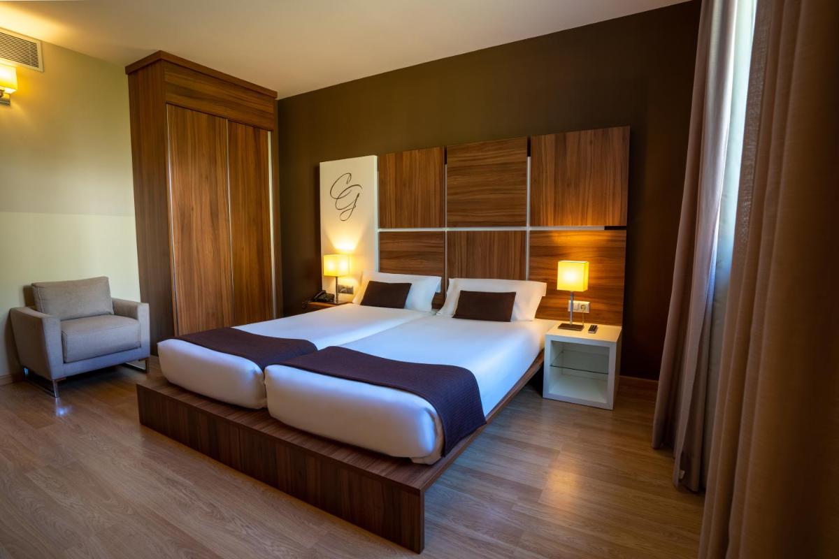 Cama o camas de una habitación en Hotel & Spa Golden Barcelona