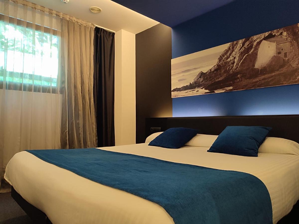 Cama o camas de una habitación en Hotel Playa Ribera